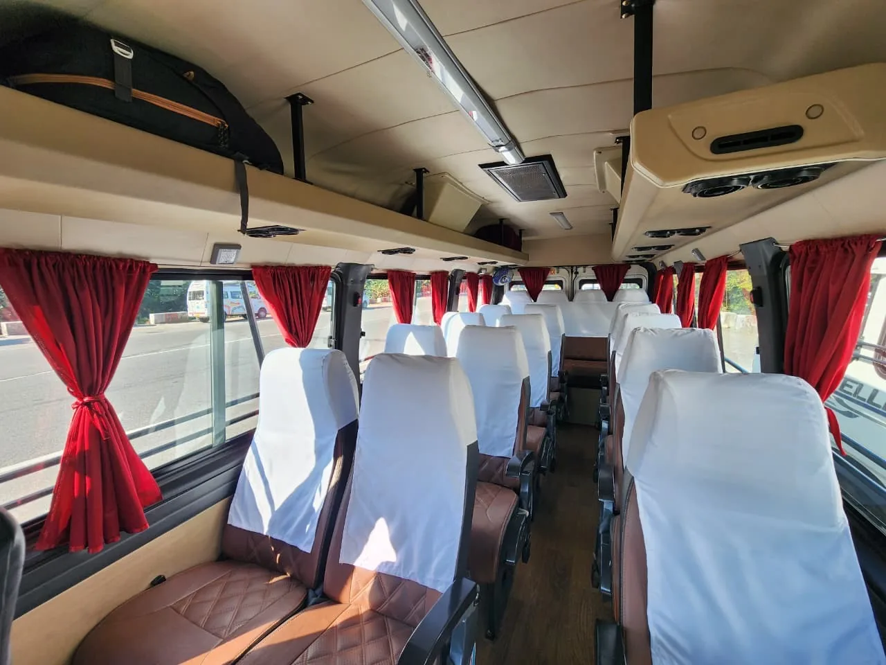 Tempo Traveller Interior with Red Curtains
