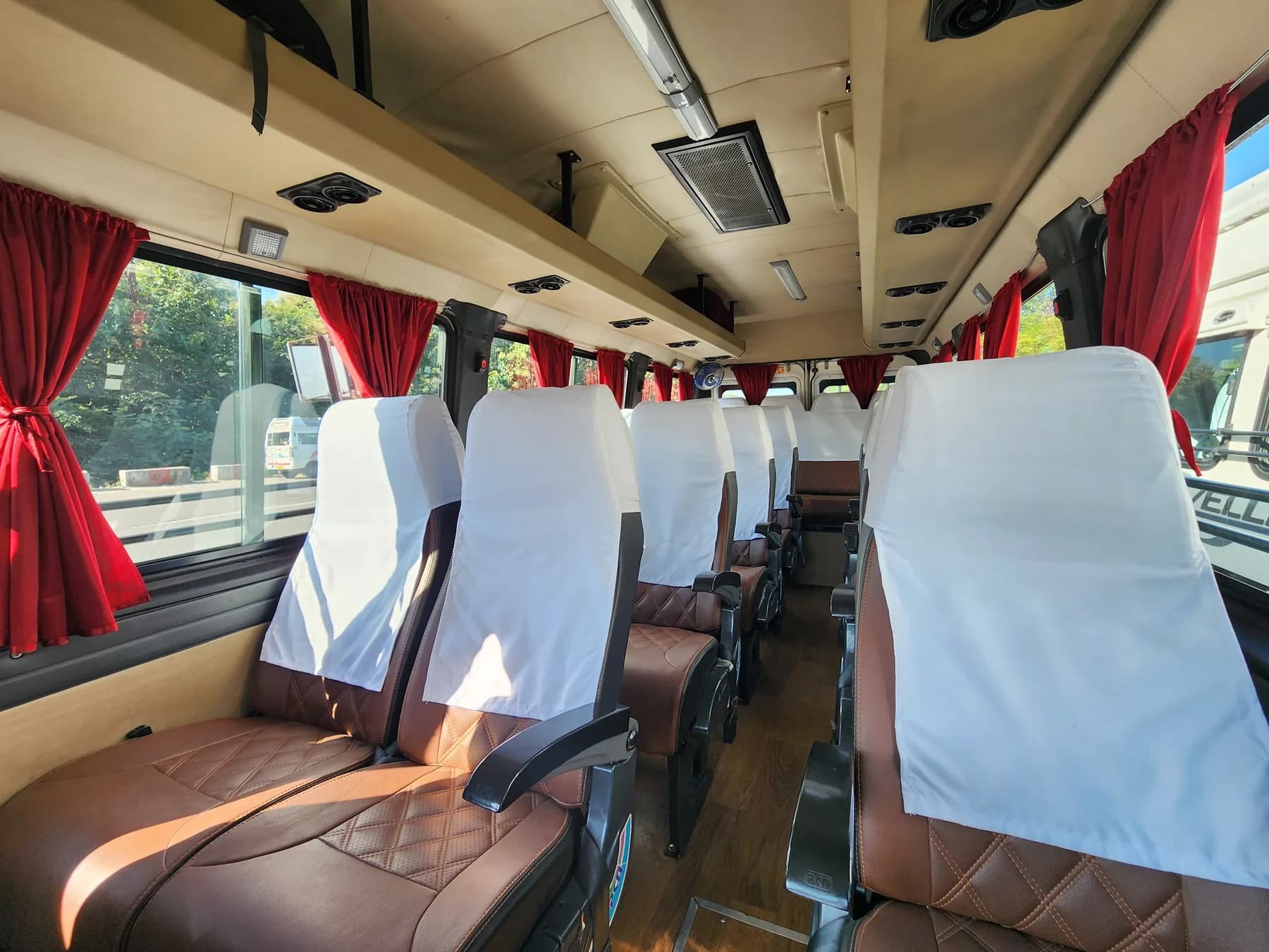Tempo Traveller Interior with White Seat Covers